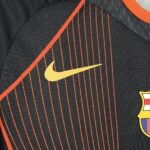 Mens Barcelona 2025/26 black orange Jersey (With Champions League) 4