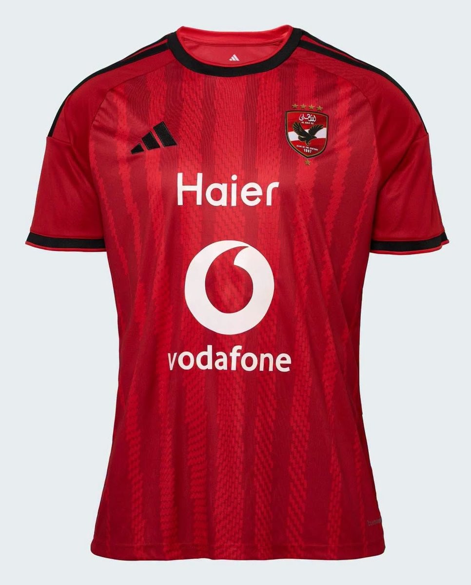 Adidas Al Ahly 2026/27 home shirt in red with black trim and wavy woven vertical stripes