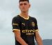 Manchester City 2026-27 Puma away kit in black with yellow and gold trim, unveiled in Hong Kong