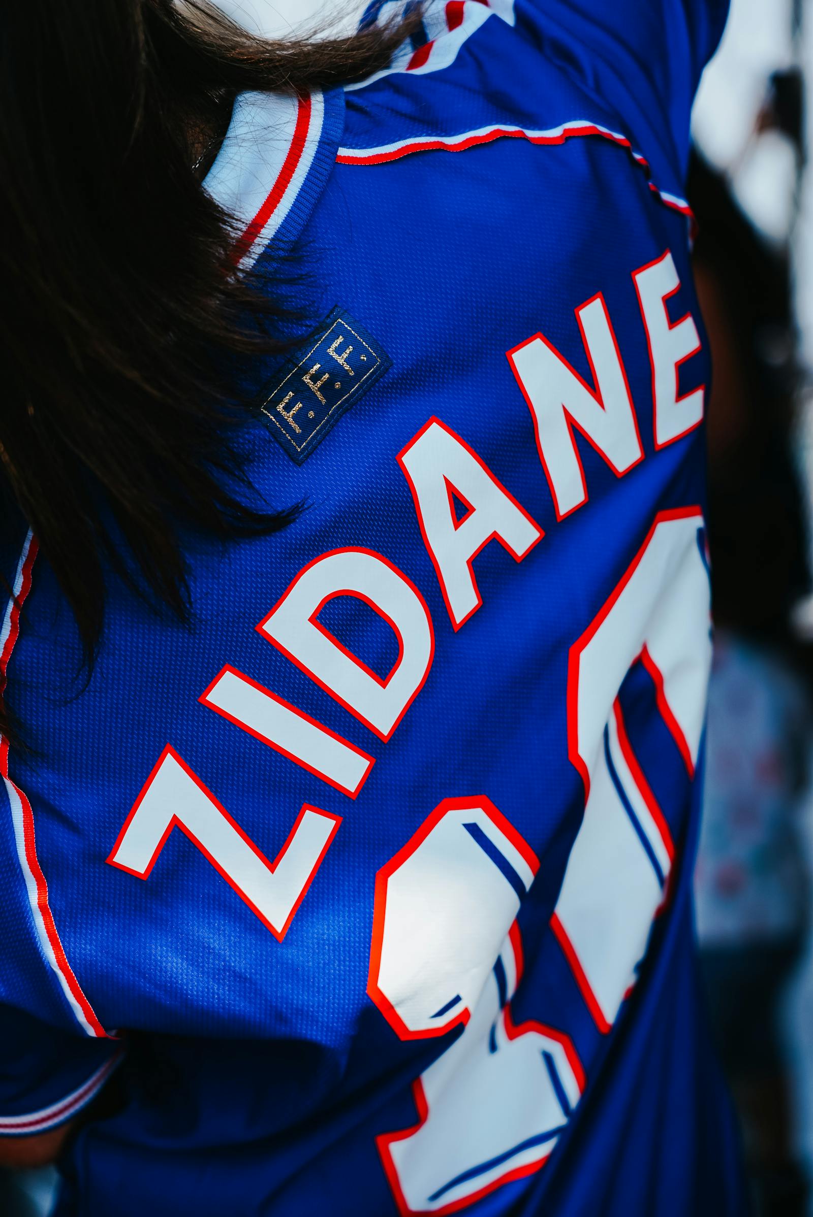 Close-up of an authentic player-version football shirt fabric and crest